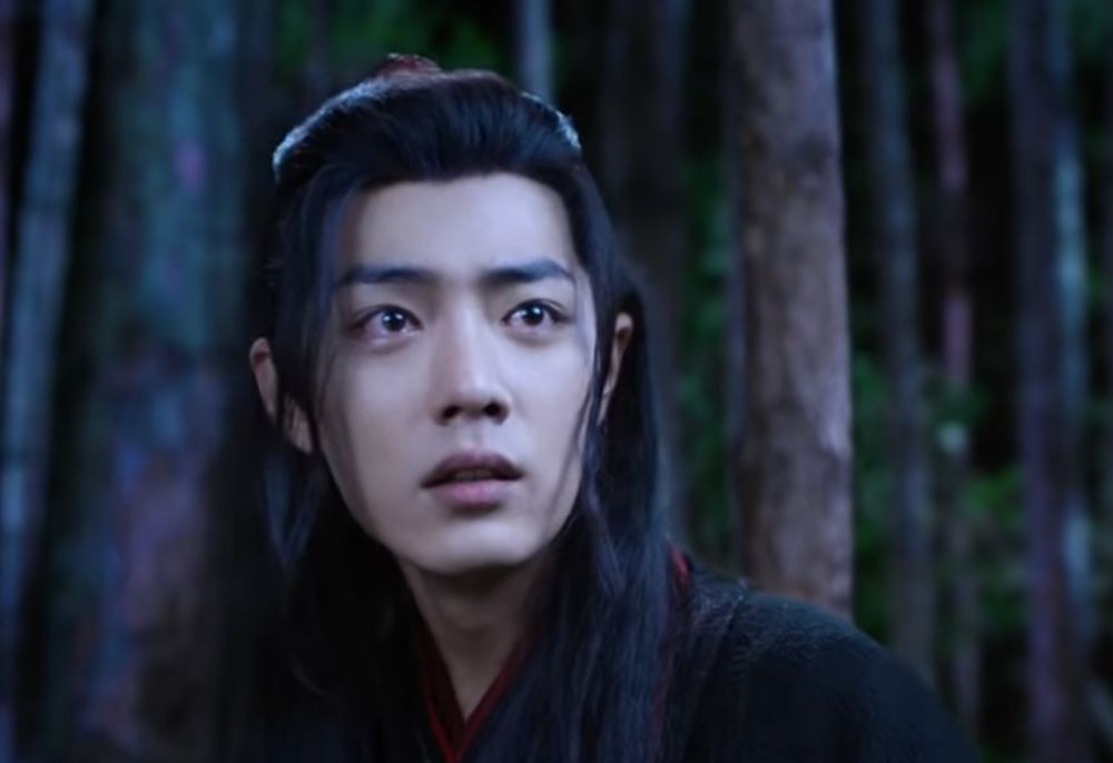 Screenshot from CQL of Wei Wuxian in the forest after Jin Zixuan's death. He looks fragile and devastated and his eyes are brimming with tears. 