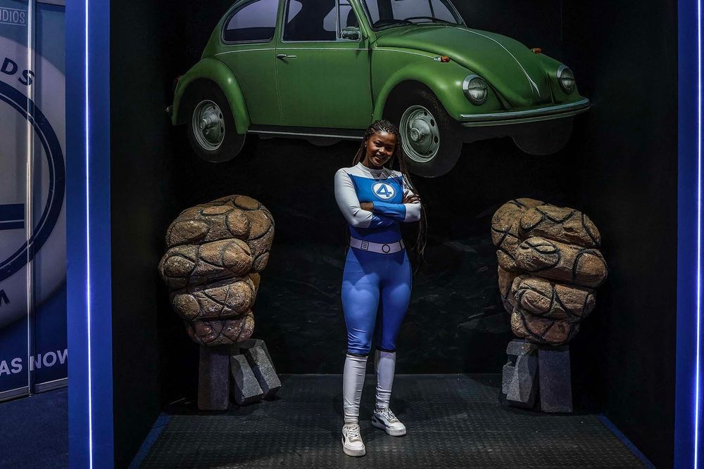 A cosplayer poses for a portrait during the Comic Con Africa at Nasrec Expo Centre in Johannesburg on August 30, 2025. With the 6th Year anniversary, Comic Con Africa is the ultimate pop culture and gaming festival taking place from 28 to 31 August 2025 and offers fans a four-day experience of cosplay, international celebrities, autograph opportunities, gaming specials, eSports tournaments, fandom-focused merch, tabletop gaming, trading card games, anime, manga, screenings, interactive experiences, and more. At this year's festival -- held at the same venue set to host G20 leaders in November -- the stars weren't on stage. They were the fans. Thousands of self-professed nerds, comic book lovers, superhero superfans and anime obsessives descended on the Johannesburg venue.  Around 70,000 people were expected to attend the convention, which runs from Thursday through Sunday. (Photo by Phill Magakoe / AFP)