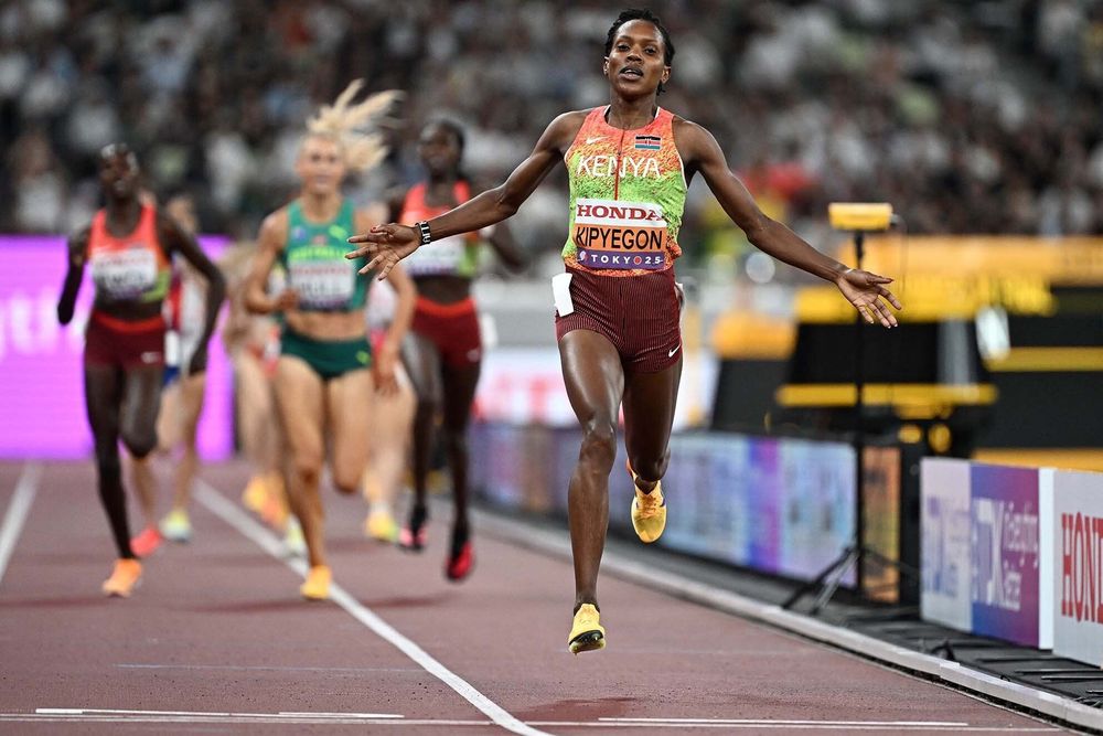 Kenya's Faith Kipyegon crosses the finish line to win the women's 1500m final during the World Athletics Championships in Tokyo on September 16, 2025. (Photo by Jewel SAMAD / AFP)