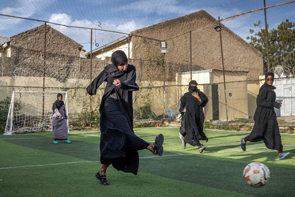 A female football player shoots the ball during a training session with their women-only football team at Ubah Inspire and Fitness Center in Hargeisa. In Somaliland, where traditional and religious values deeply influence societal norms, groups of determined women are breaking barriers through sports. (Photo by LUIS TATO / AFP).