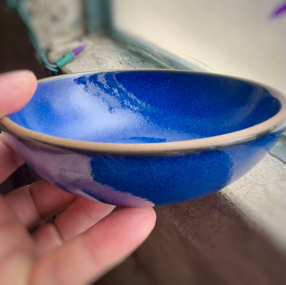 Blue moonstone ceramic dessert bowl with a wiped, natural clay rim, made by Heath Ceramics in Sausalito, California. 