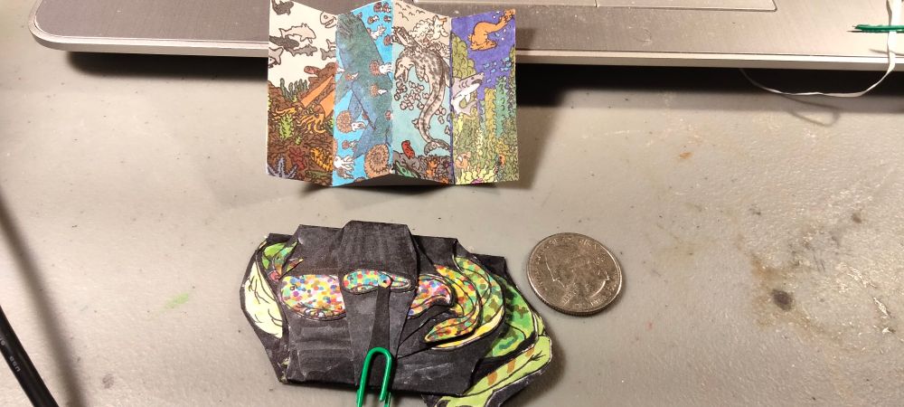 The final finished piece as well as a quarter for scale and the Seaside Sketches Through Time to show its size. 