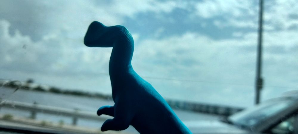 Sometimes it's fun to have a little buddy while you're on the road. 

Picture is a sculpt I made of a crested early theropod looking out of the window. (Possibly a Megapnosaurid)