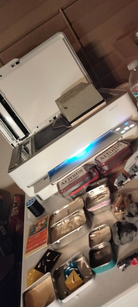 Altoid cans being turned into dioramas and printer scanning illustration.
