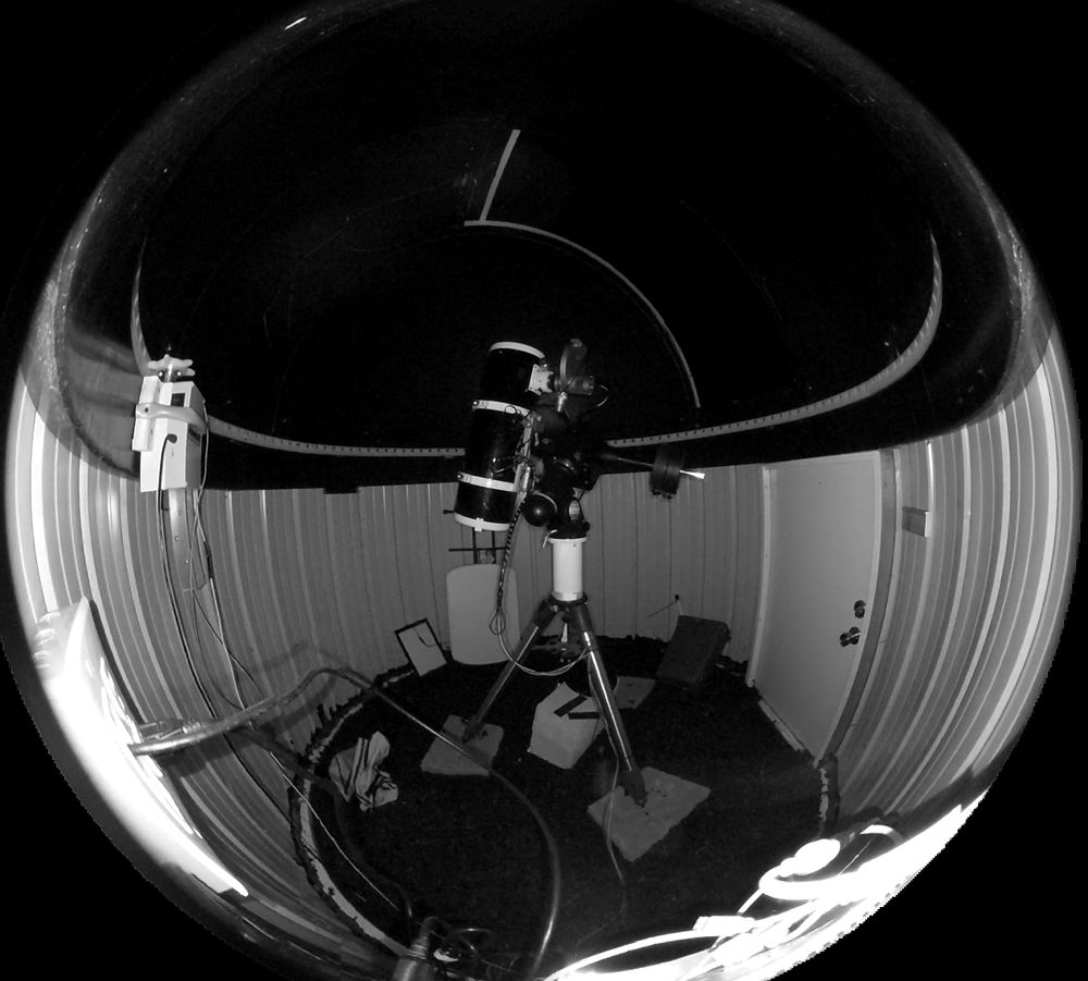 A picture taken with a fish-eye camera of the inside of my observatory. The telescope is pointing out though the shutter in the dome.