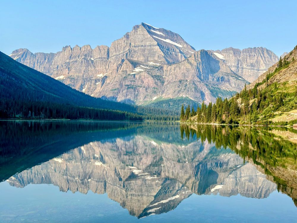 Mountain reflected in a still lake in Glacier National Park