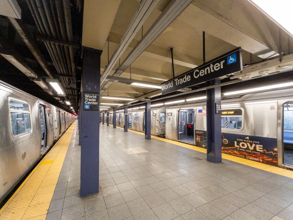 Platform at World Trade Center with a train on each side of the island platform.