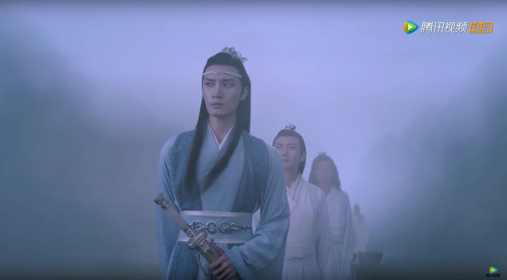 Screenshot from CQL, Ep. 5. Cultivators on the a boat on Lake Biling, surrounded by mist. Lan Xichen is seen centre-frame from the hip upwards giving the mist a massive sideeye. Behind him is Su She and other unnamed Lan disciples. 