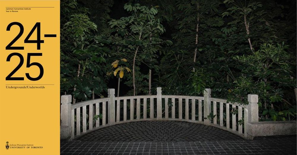 A stone walkway bordered by a curved, pale stone balustrade with vertical slats. Dense green foliage and tall, leafy trees rise closely behind the railing, partially illuminated by light. The scene is dark, suggesting nighttime or deep shade. The tiled ground is made of dark, square cobblestones. The text overlay is The Jackman Humanities Institute Year in Review 24-25.