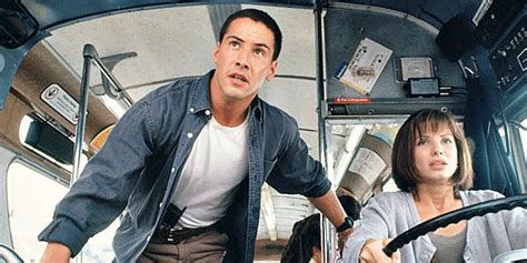 A still from Speed with Keanu and Sandra Bullock at the front of the bus. 