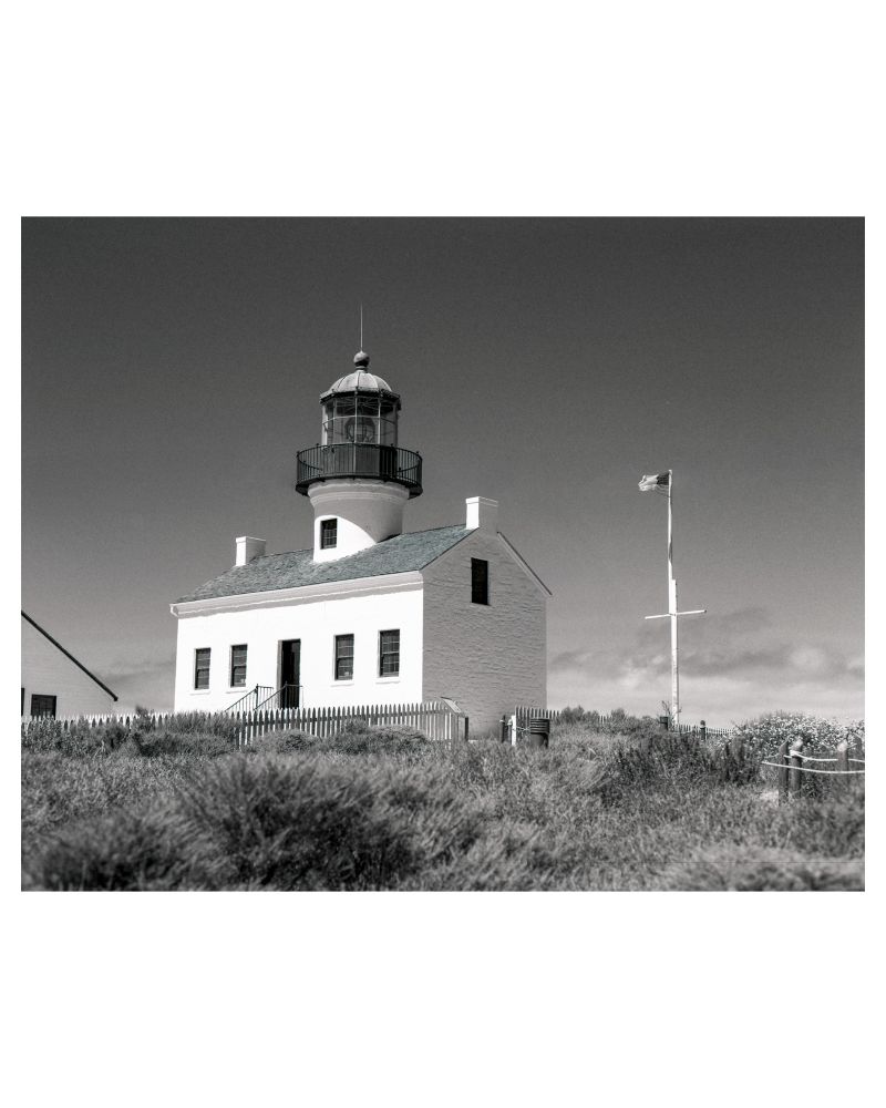 A black and white photograph of the Old Point Loma Lighthouse, built in 1855. At the time, it was the highest elevation lighthouse in the United States. 
