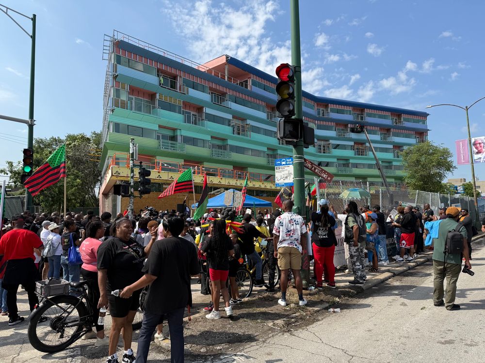 A large garnering of people post parade rallying at the site of a future affordable housing project 