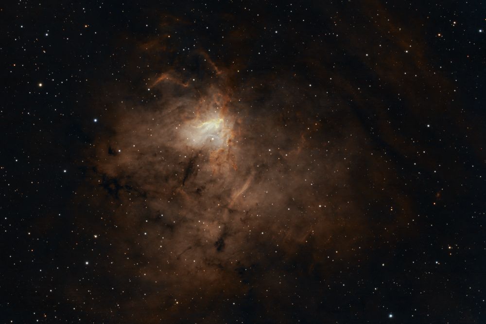 Image of the emission nebula NGC 1491 processed in a HOO palette with yellowish brown hues. This target has a very bright but rather small core.
