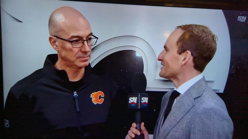 Calgary Flames coach Ryan Huska looking like is Pierre McGuire fucked