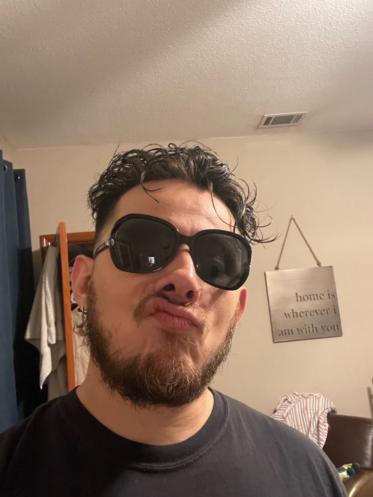 Sleepy guy with big sunglasses to hide how sleepy he is