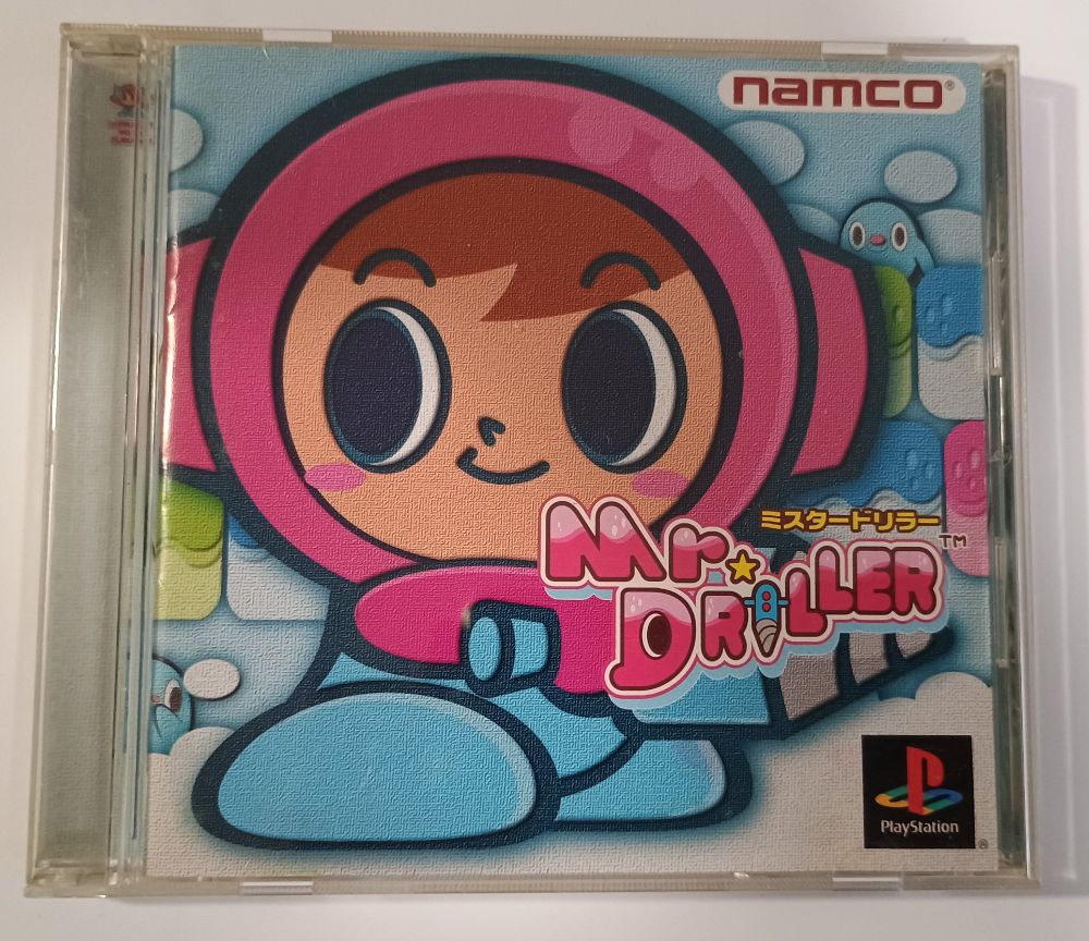 Cover of Mr Driller for the PS1.  Show the titular character, a cartoon man with a helmet and a drill.