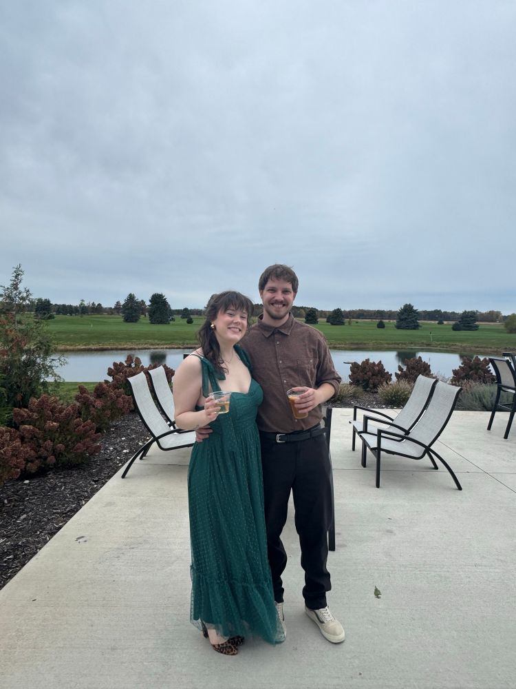 Me and my man dressed in long green dress,
Brown dress shirt and black pants, vans 