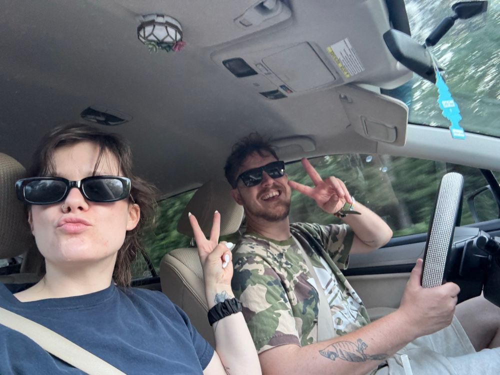 Road trip millennial selfie duck lips and peace signs 
