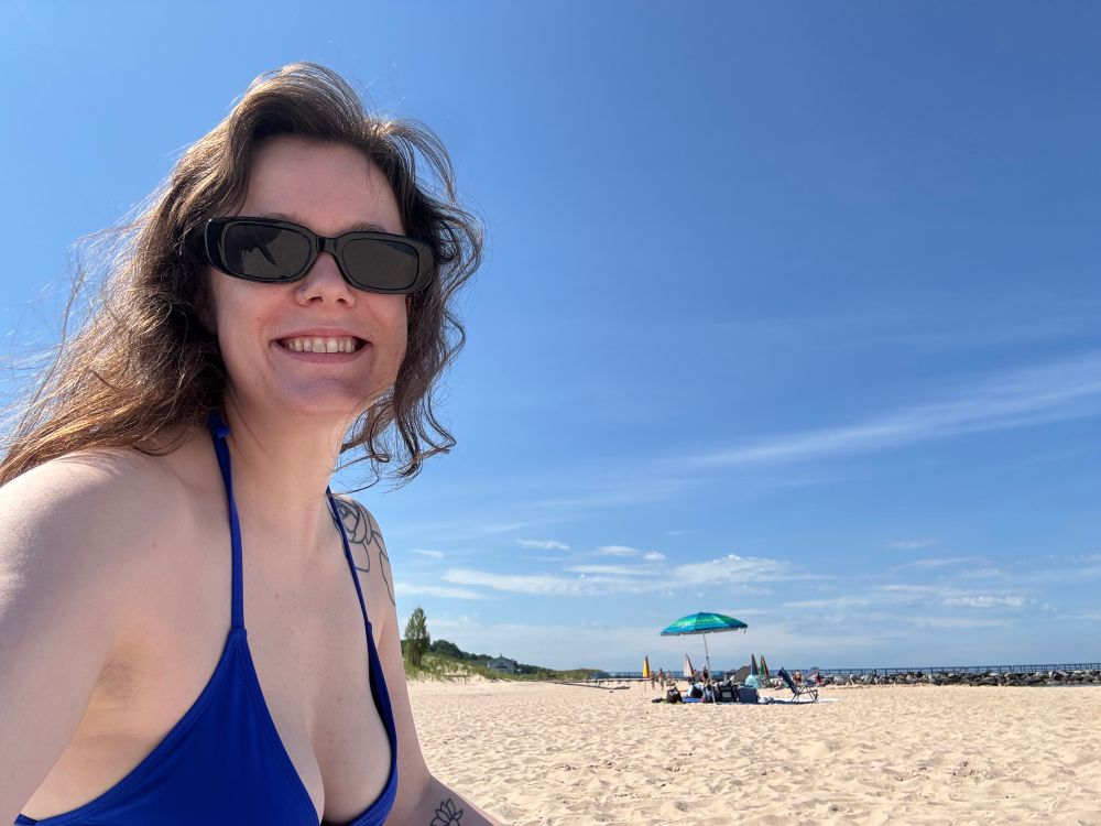 Me on the beach smiling for camera 