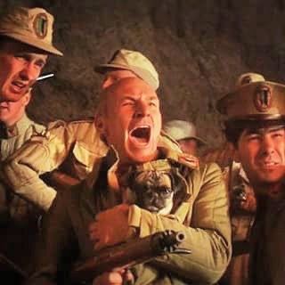 Gurney Halleck (Patrick Stewart) holds a pug and rifle, gives a battlecry. (Dune, 1984)
