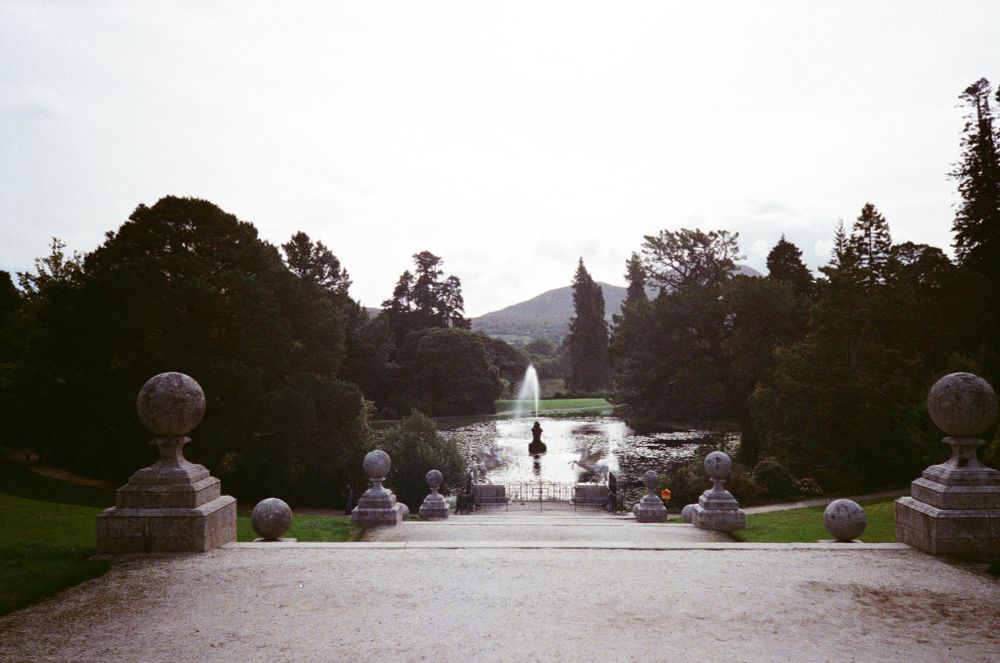 Stairs and path leading to fountain in pond at Powerscourt, Ireland