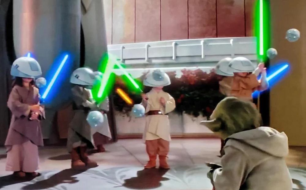 Jedi youngling lightsaber training as overseen by Master Yoda.
