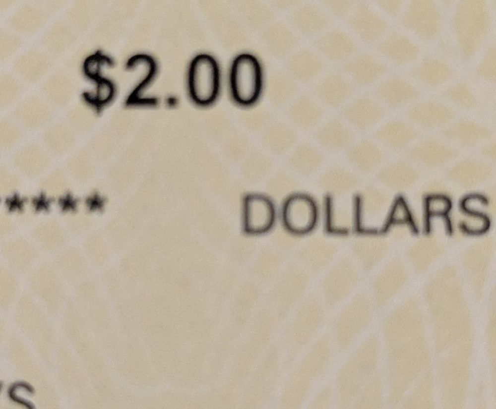 A check for $2 I got for my third place coffee cake