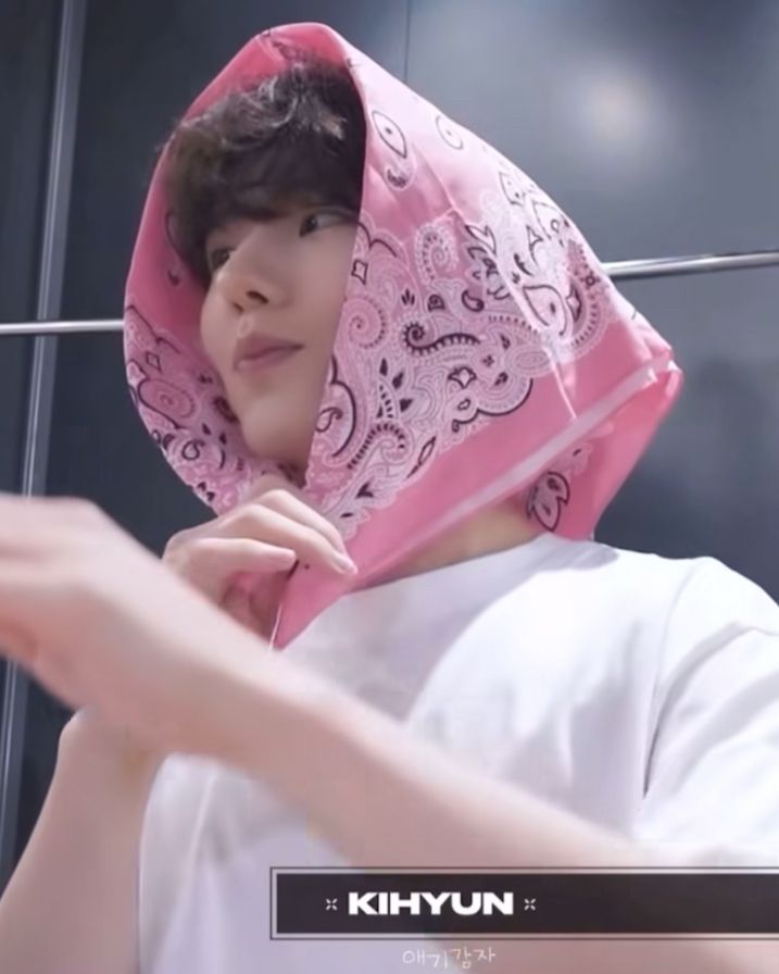 Monsta x Kihyun wearing a pink bandanna on his head 