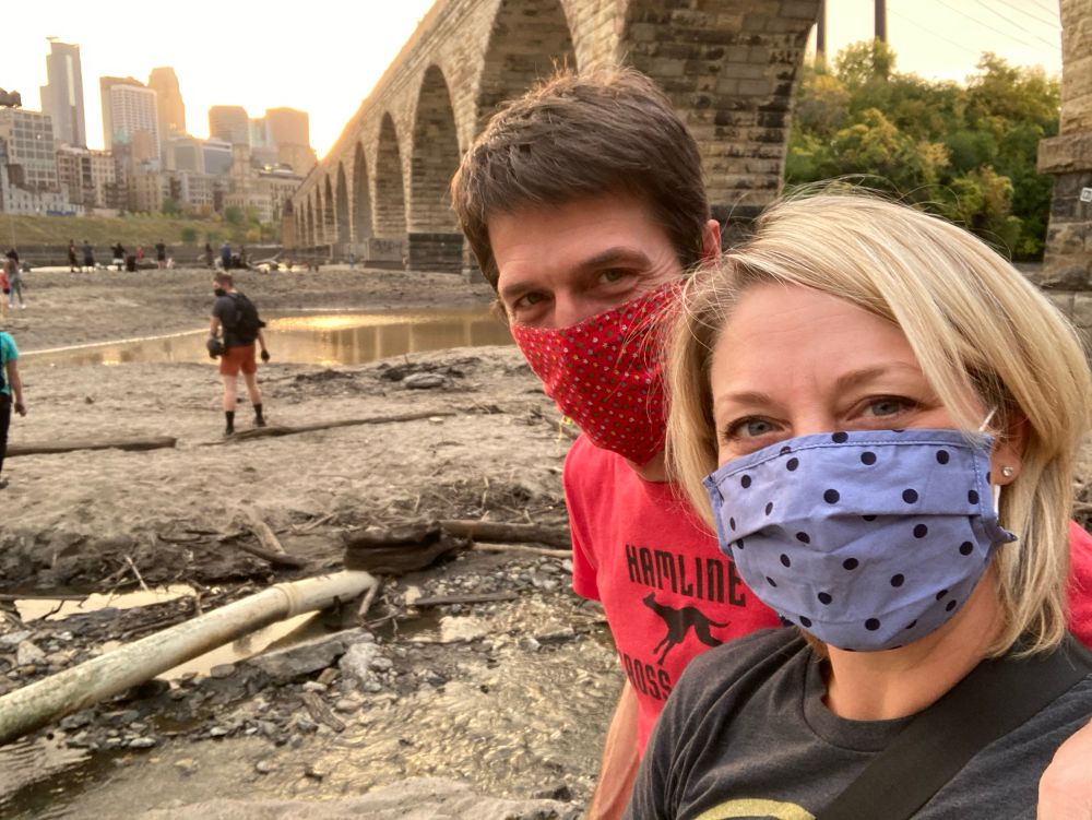 Doron and Molly walking under the Stone Arch Bridge from when it was drained. 