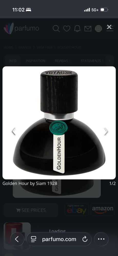 Golden Hour by Voyager perfume bottle. Image from Parfumo. The bottle is black glass and has a green faux wax seal on it. 