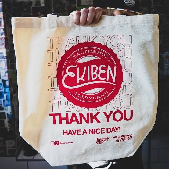 A tote bag from Baltimore's Ekiben includes the business's logo and the phrase, "Thank you. Have a nice day." 
