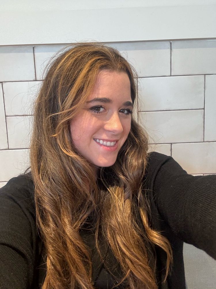 Smile selfie of girl with blonde & brunette hair 

