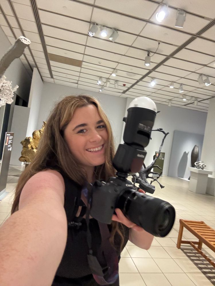 Selfie of girl with camera smiling 