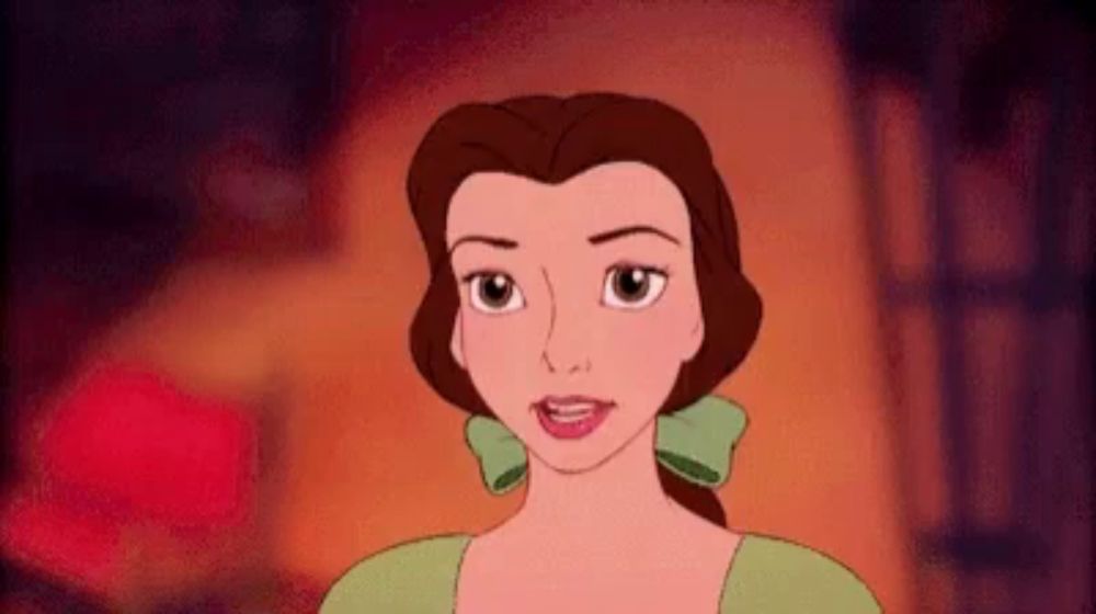 belle is a cartoon character from beauty and the beast wearing a green dress and a green bow in her hair .