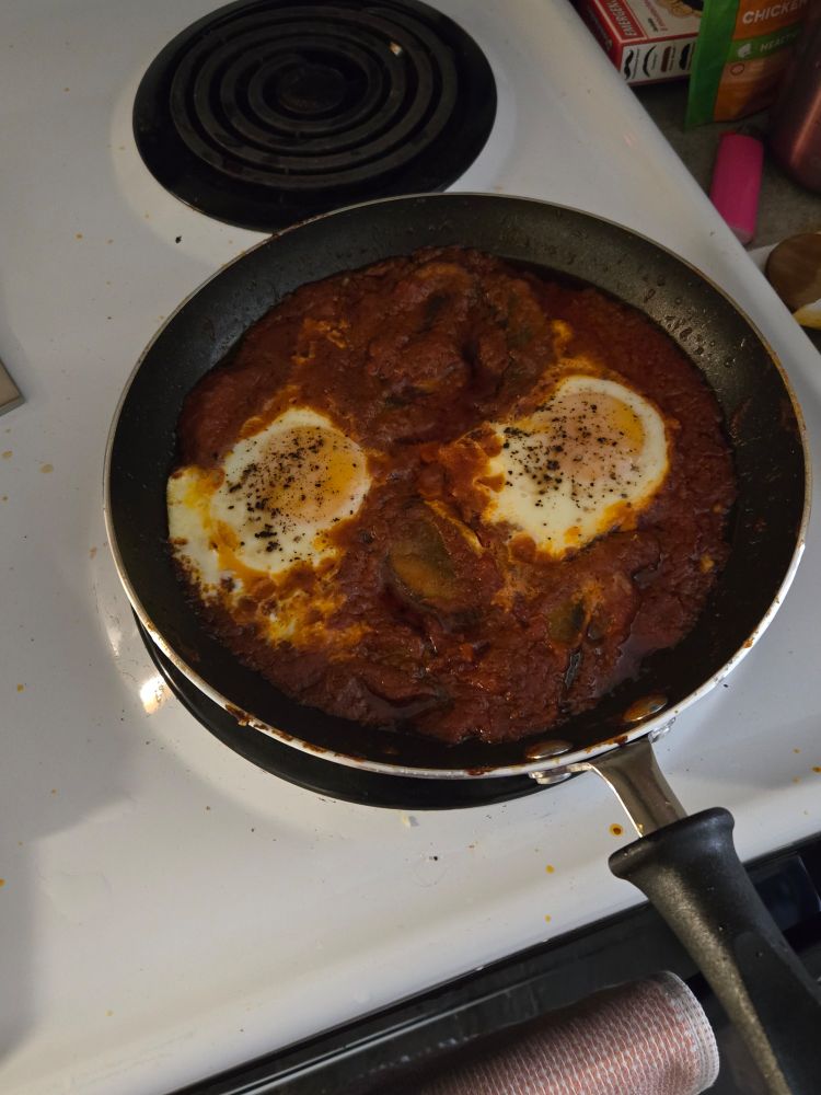 Eggs in a tomato sauce, maybe looks to be shakshouka but be not deceived.