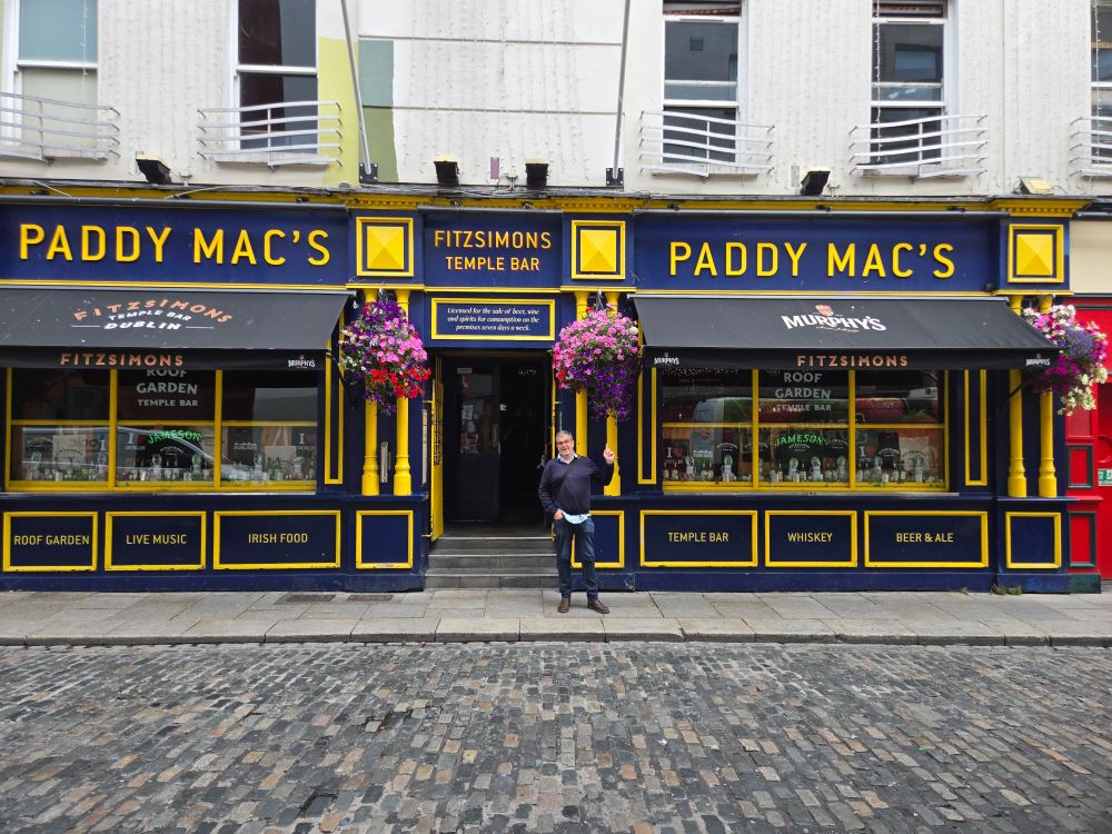 A photo of Paddy MacMahon outside Paddy Mac's bar in Dublin.