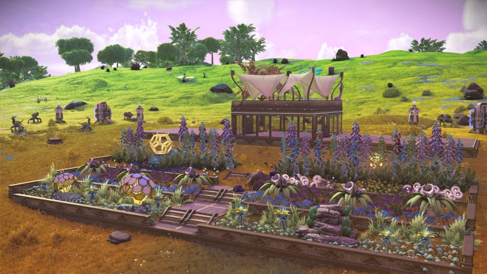 Outside landscape view of a tiered garden and small building behind it. 