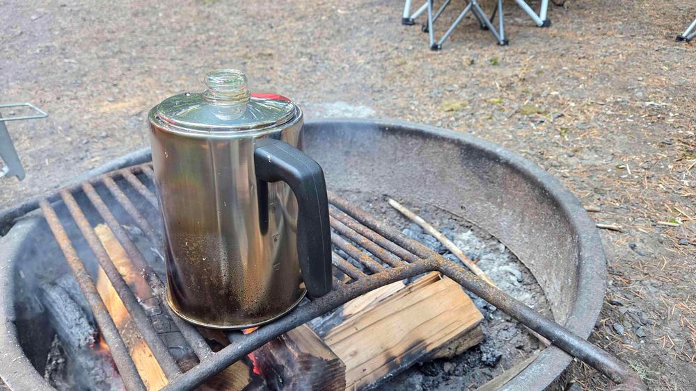 Coffee percolates over a campfire 