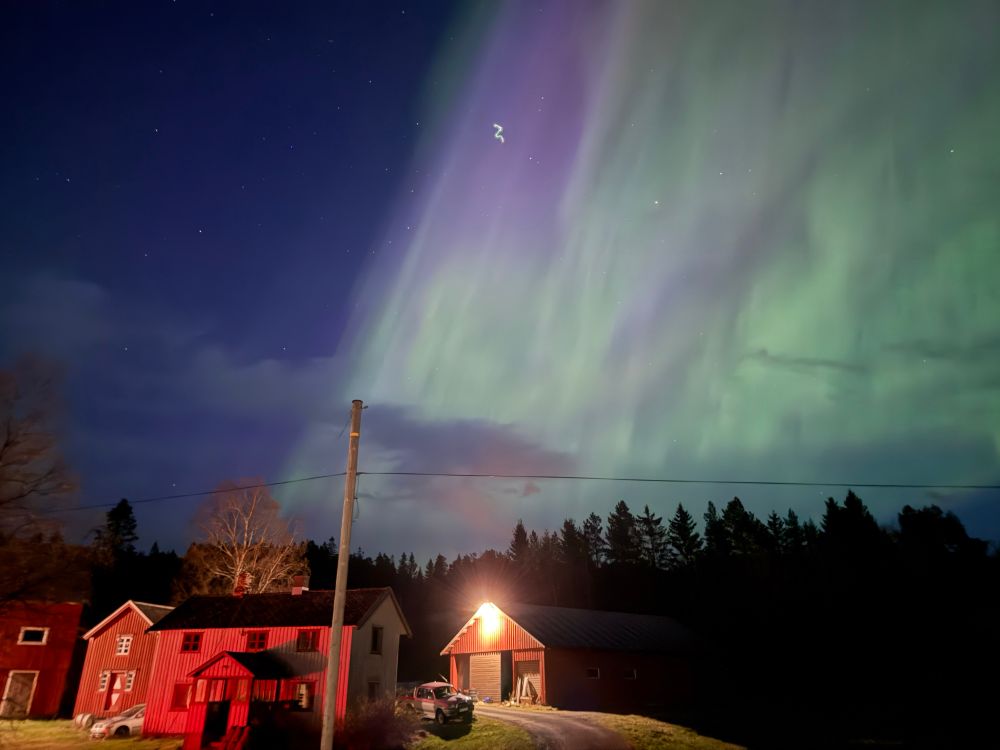 Northern lights with houses