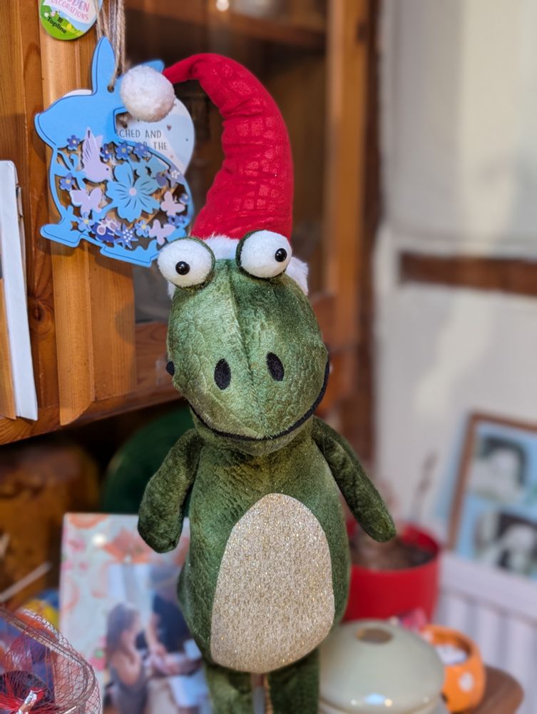 Front view of daft looking Christmas dinosaur
