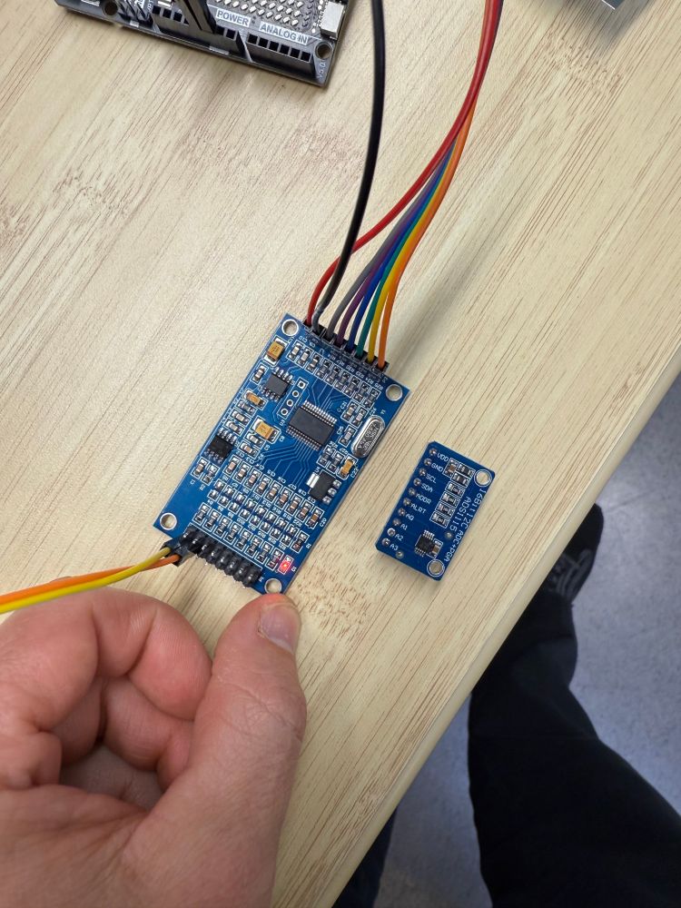 ADS1256 module PCB with lots of supporting components next to a ADS1115 smaller PCB with fewer components.