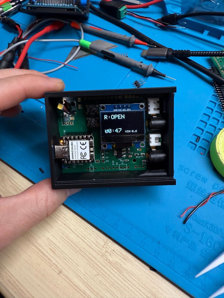 Arduino Uno sized PCB in a small box, turned on with the display reading 0.