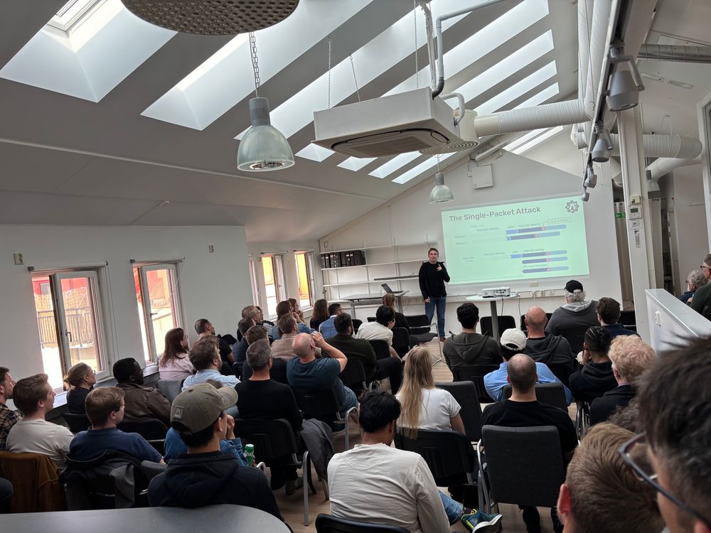 Audience and presenter in a conference setting