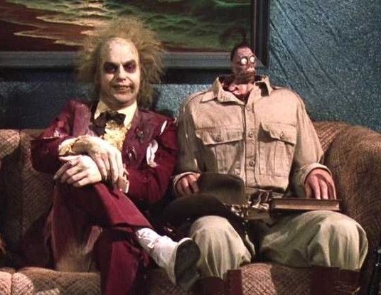 Beetle juice and small head guy on the couch in the oval office