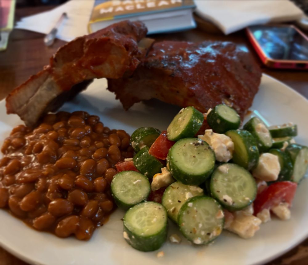 Delicious pork ribs made by my future in laws and a cucumber feta tomato salad made fresh by my fiancée 
