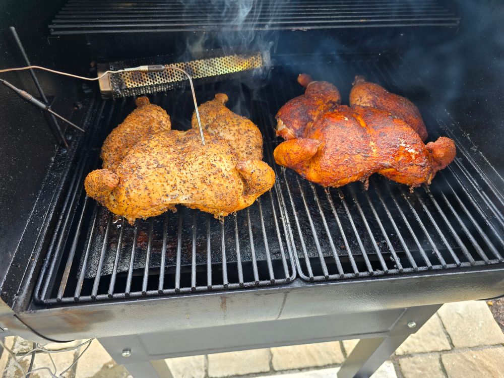 Picture of two chickens on the smoker.
