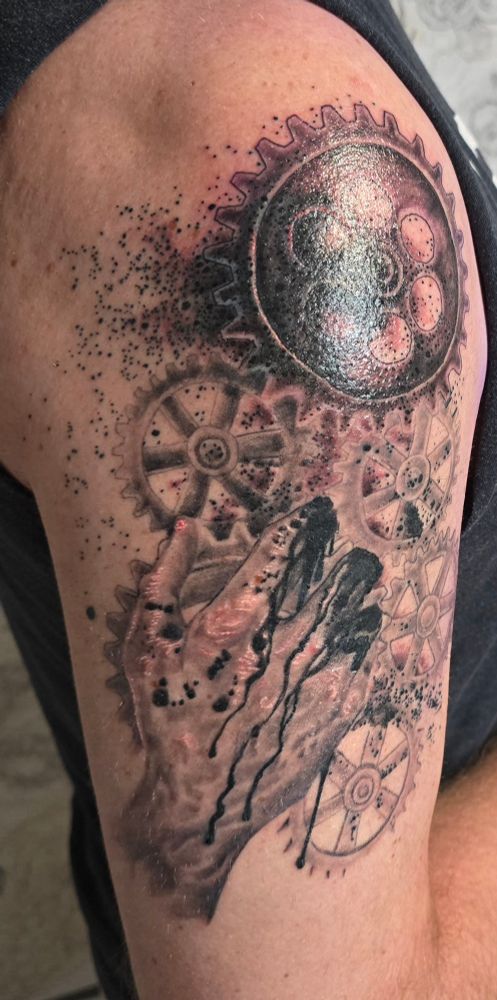 Tattoo on upper arm of an artistic interpretation of Mario Savio's "Body's upon the gears" speech.