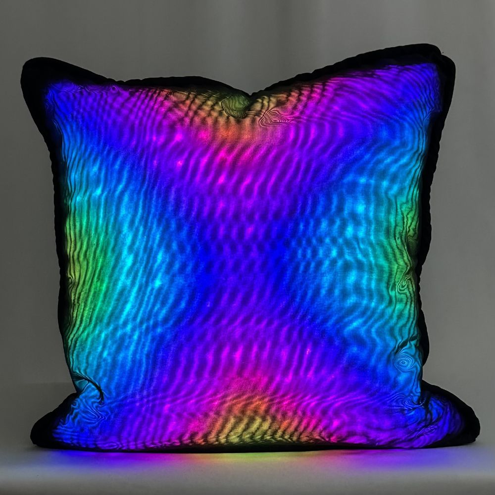 throw pillow with rainbow colored lights
