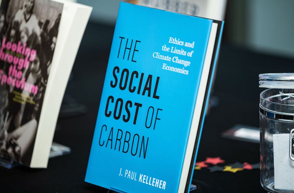 A photo of my book, THE SOCIAL COST OF CARBON, on a display table next to
“Looking through the Speculum: Examining the Women’s Health Movement” by my colleague Judith A. Houck