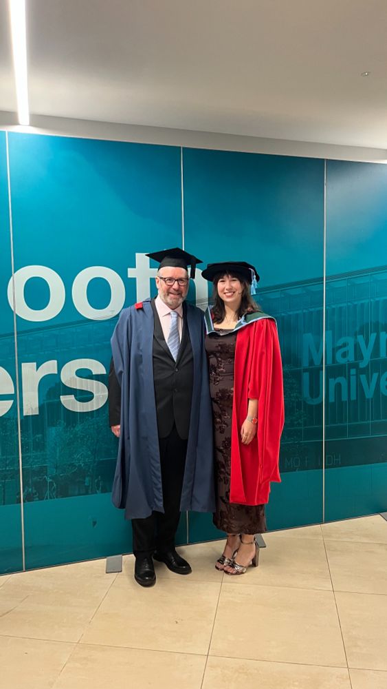 Photograph of myself and Dr Aoibhinn Gallagher, both in academic dress, immediately after Aoibhinn formally received her PhD from Maynooth University